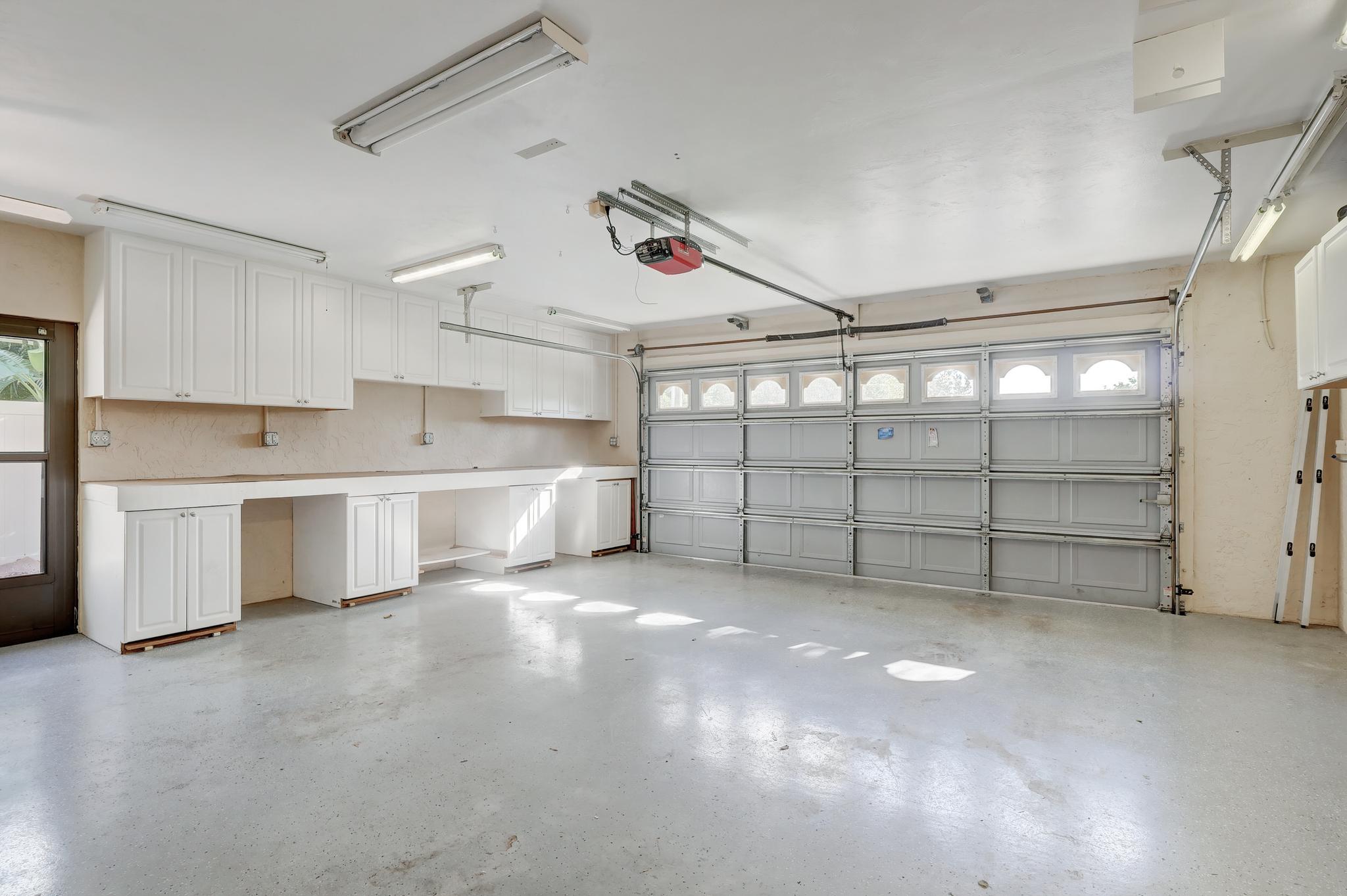 The Garage Door Is Hurricane Rated and Has Bars To Place On It During Storm Events