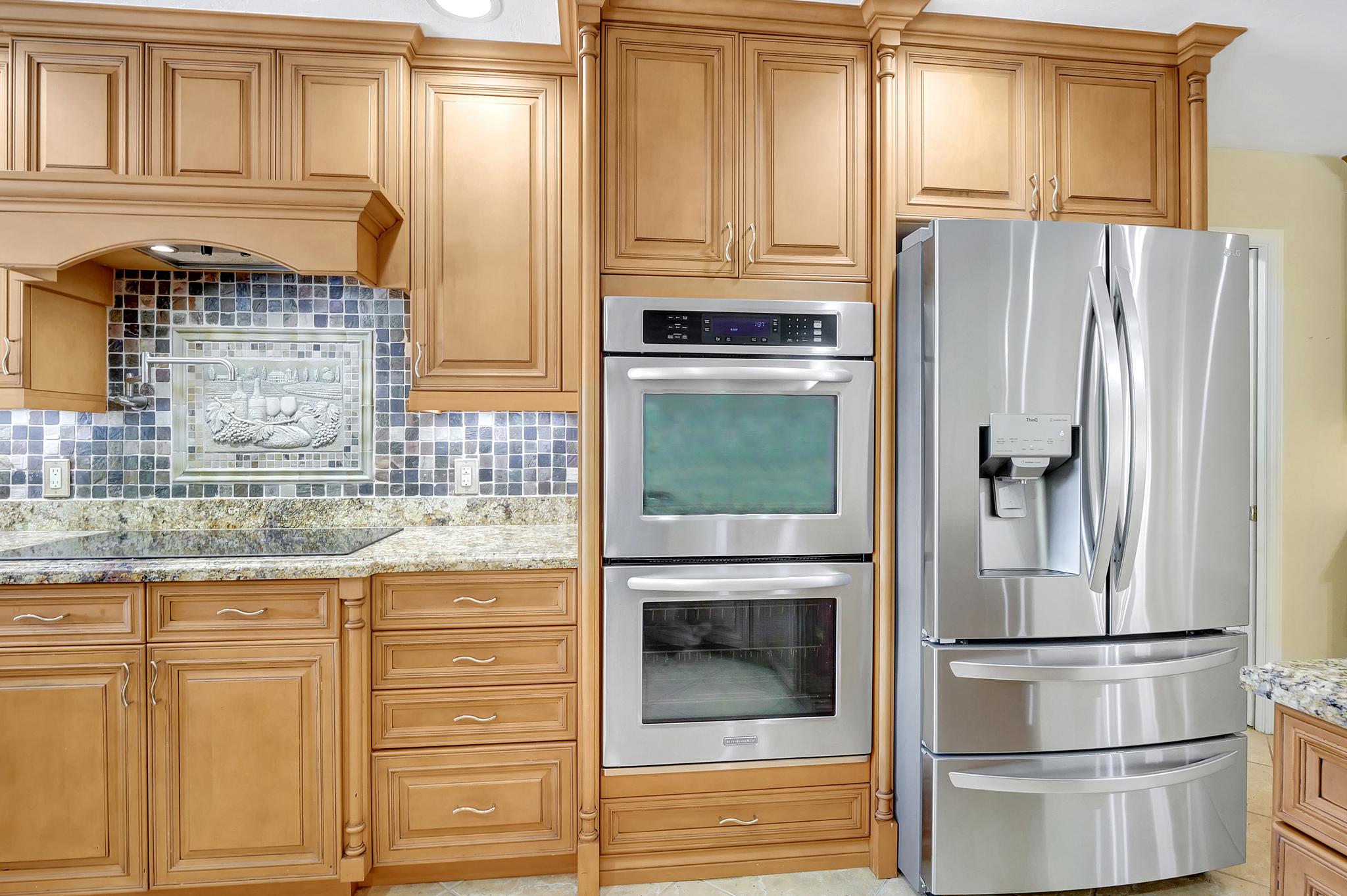 There is a Double Oven, a Pot Filler, a Glass Stove Top and a Fridge with Double Pull Out Freezer Drawers