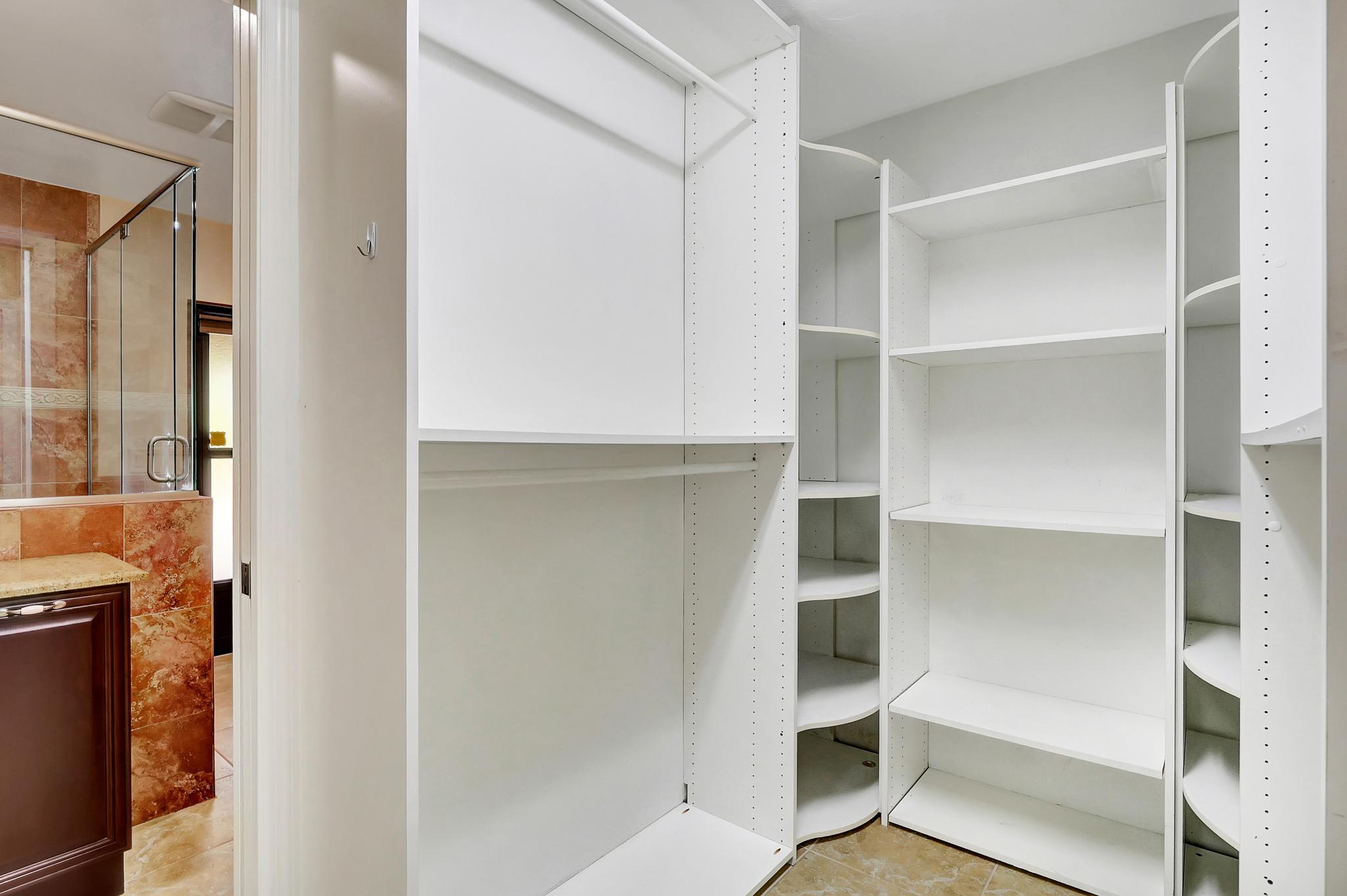The Main Bedroom Closet Is Located In Between the Main Bedroom and the Main Bathroom 