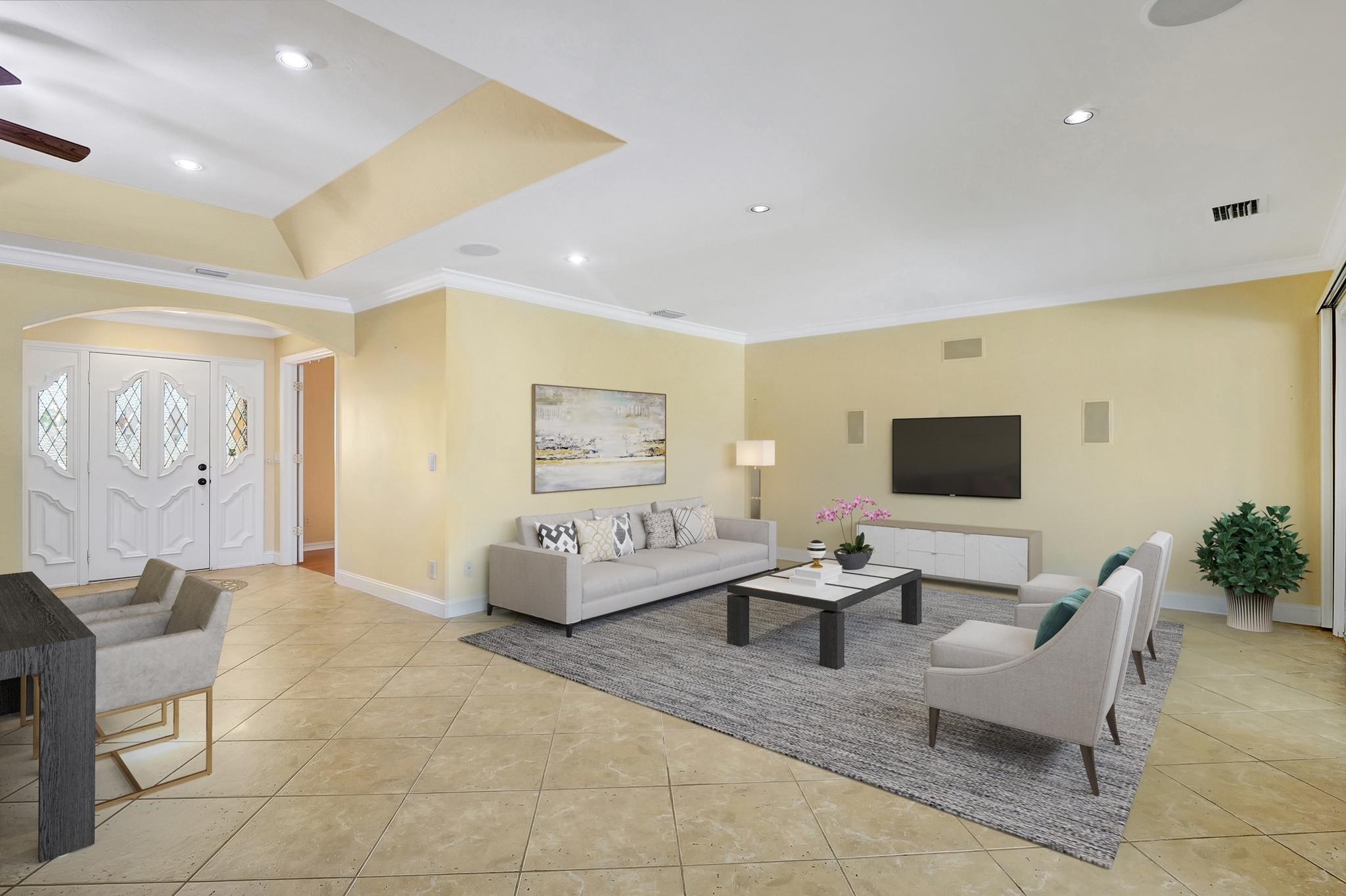 This photo has been digitally staged to show how this area of the home can be furnished 